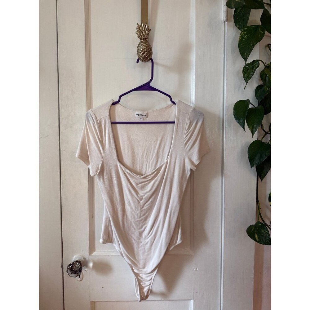 Super down women’s size medium white bodysuit